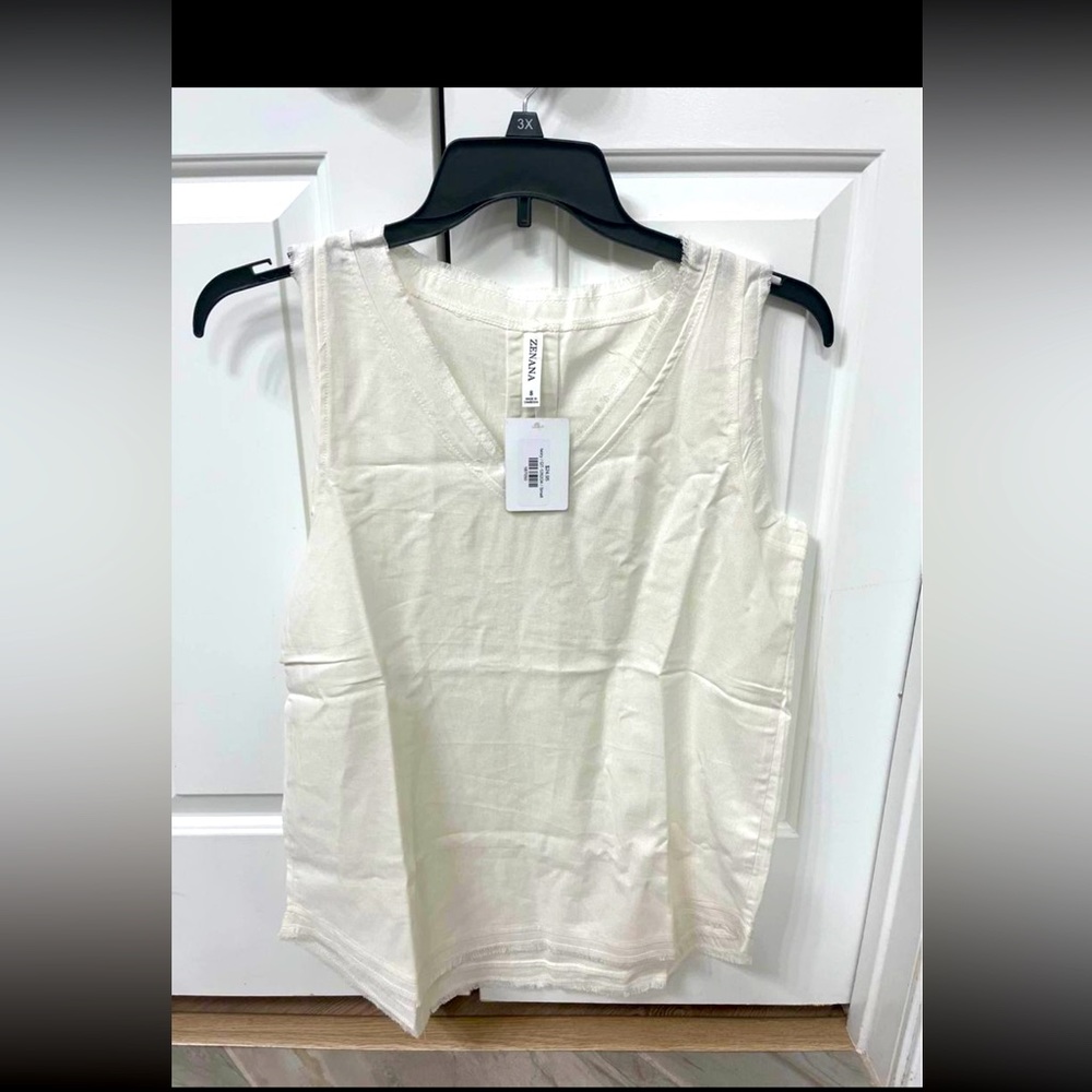 NWT off white linen sleeveless top with cute detail edges around neckline.